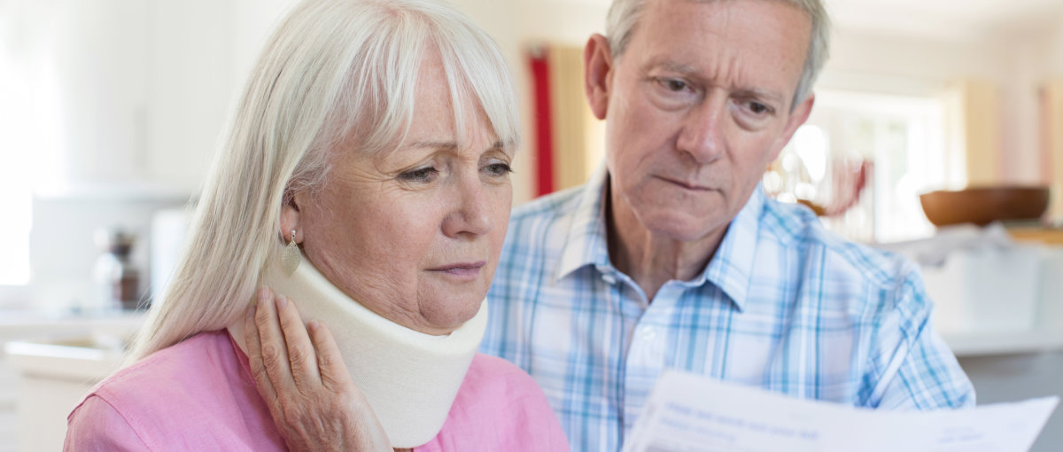 Mature Couple Reading Letter About Wife's Injury